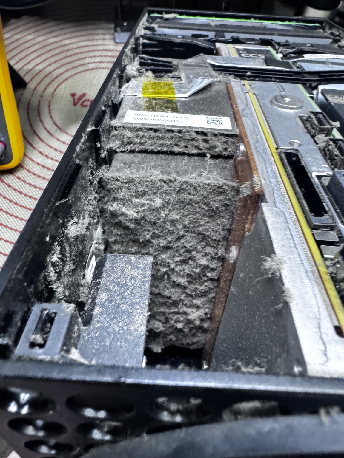 Close view of heavy dust buildup inside a game console