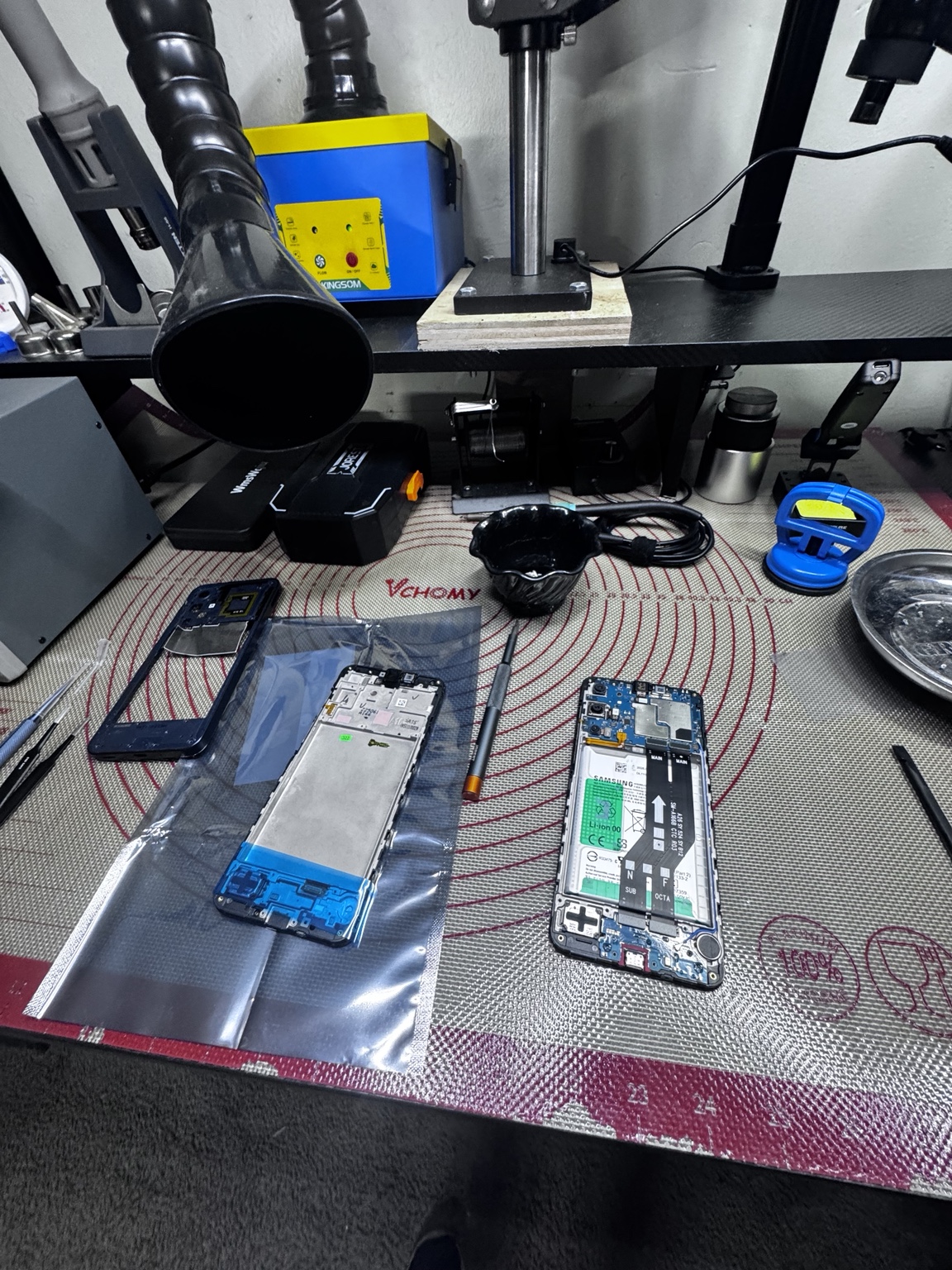 Samsung Galaxy phone disassembled on the repair bench